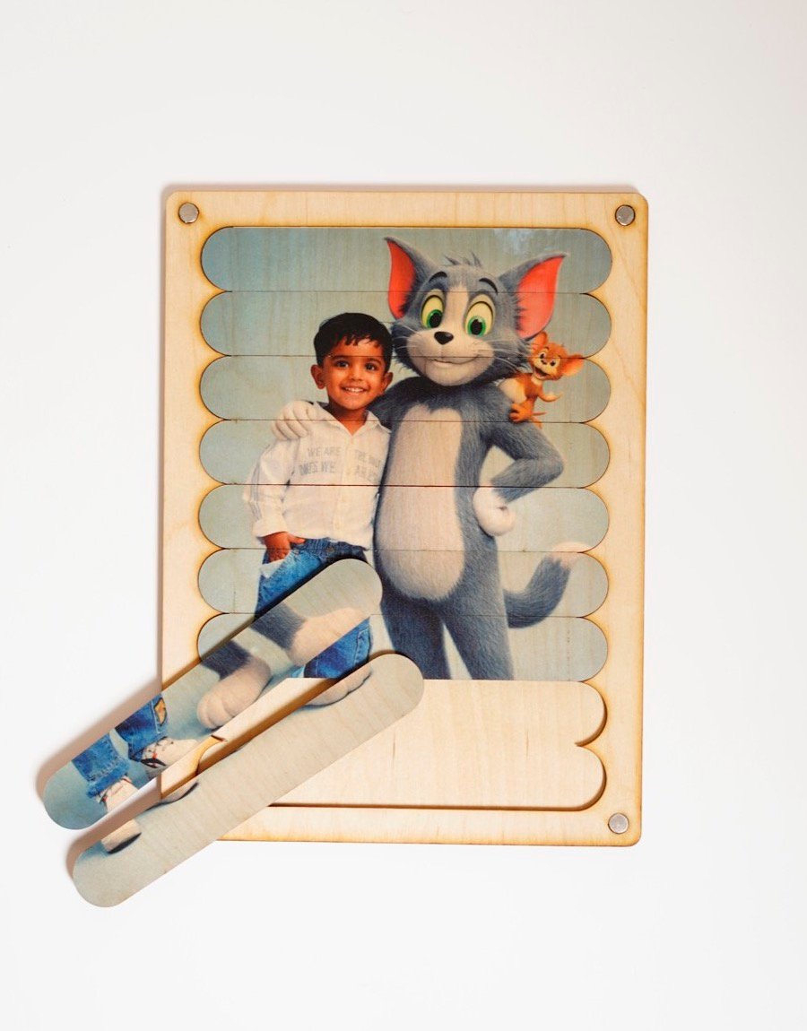 Child-safe chunky wooden puzzle sticks being placed into the magnetic frame